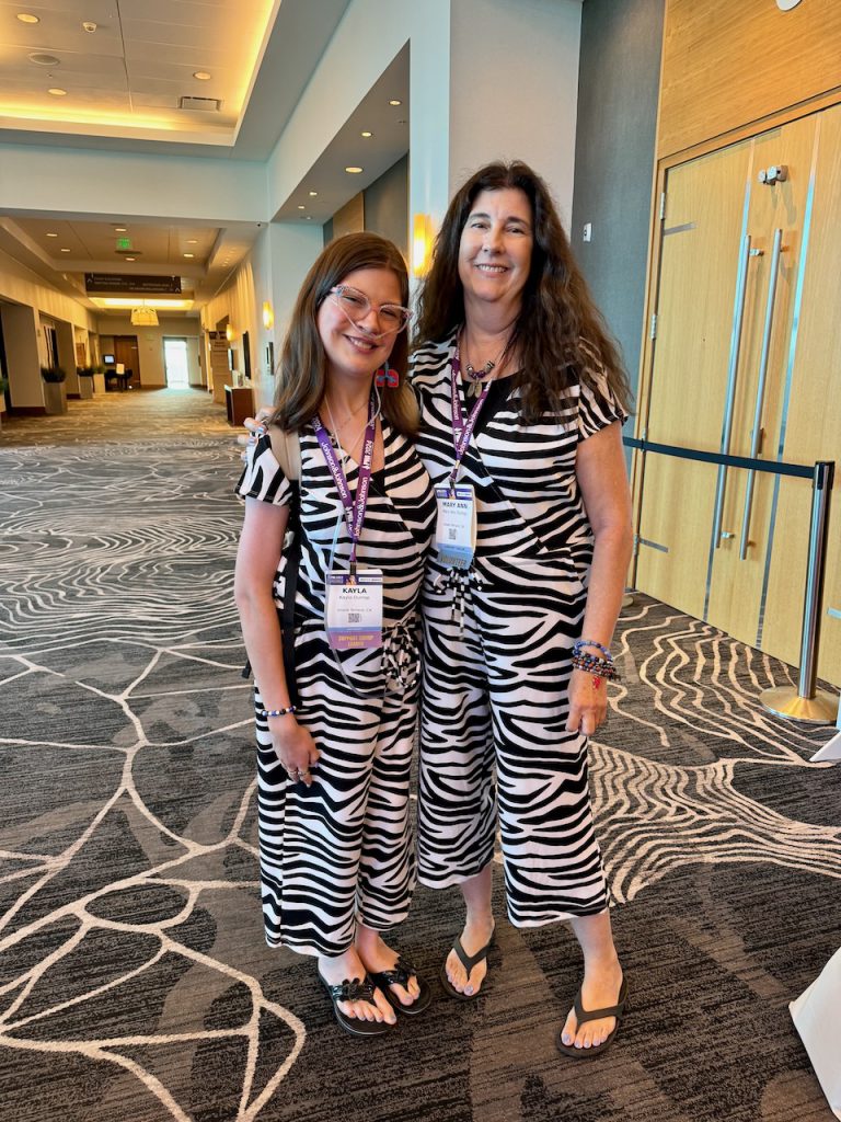 A mom and her PH daughter in zebra outfit