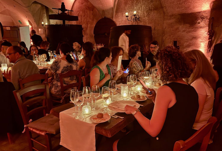Dinner in the wine cellar of an old Italian mansion